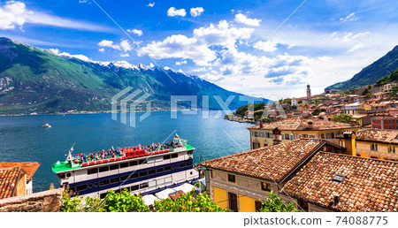 Amazing scenery of Lado di Garda, cruise boat in Limine town. Italy Amazing scenery of Lado di Garda, cruise boat in Limine town. Italy 74088775