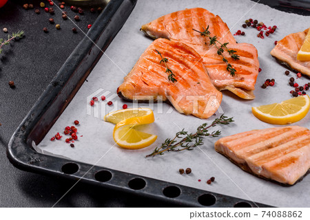 Tasty fresh red fish arctic char baked on a grill Tasty fresh red fish arctic char baked on a grill 74088862