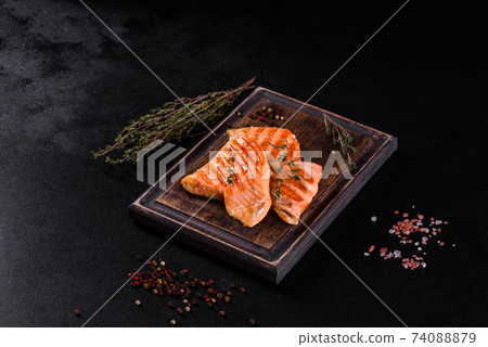 Tasty fresh red fish arctic char baked on a grill Tasty fresh red fish arctic char baked on a grill 74088879