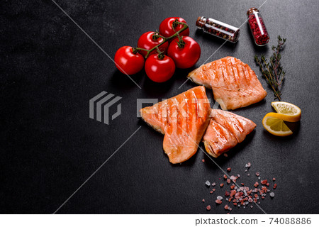 Tasty fresh red fish arctic char baked on a grill Tasty fresh red fish arctic char baked on a grill 74088886