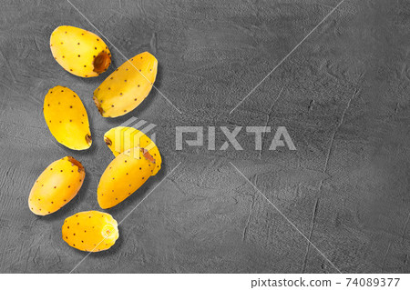 Falling fresh fruits on concrete grey bacground Falling fresh fruits on concrete grey bacground 74089377