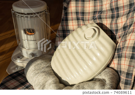 Hot water bottle stove heating winter 74089611