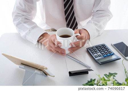 Senior businessman making a coffee break during telework 74090817