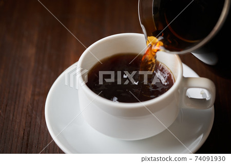 pour coffee into a cup pour coffee into a cup 74091930