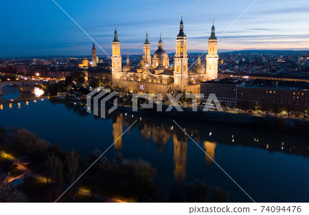 Night aerial view of Zaragoza with Basilica 74094476