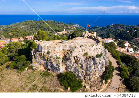 Bird's eye view of ruined rock fortress scenic view in Begur, Catalonia 74094718