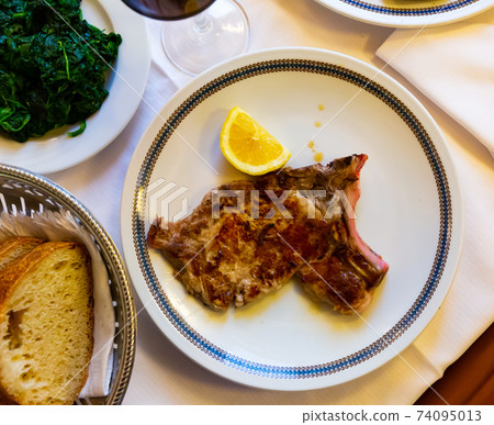 Italian dish - traditional veal chop with lemon Italian dish - traditional veal chop with lemon 74095013