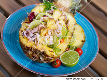 Salad with calamari, pineapple and lime Salad with calamari, pineapple and lime 74095183