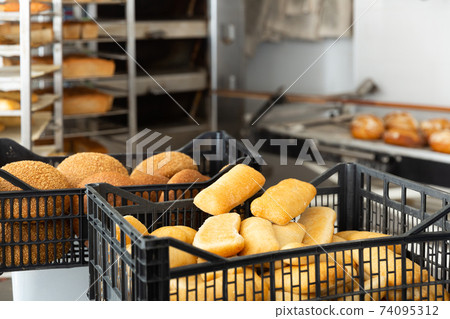 close up of baked bread in bakehouse 74095312