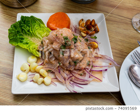 Seafood ceviche from hake with onion and vegetables Seafood ceviche from hake with onion and vegetables 74095569