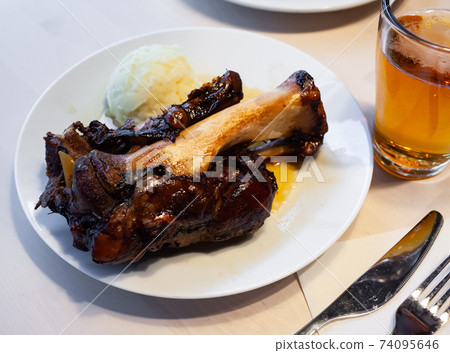 Baked pork knuckle with mashed potatoes Baked pork knuckle with mashed potatoes 74095646