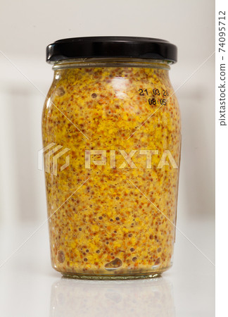 Closed jar of wholegrain mustard 74095712