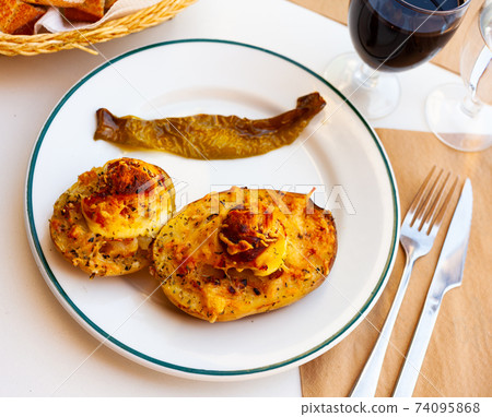 Appetizing stuffed potatoes with boiled egg Appetizing stuffed potatoes with boiled egg 74095868