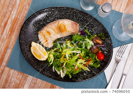 Porbeagle shark fish steak with fresh vegetable salad Porbeagle shark fish steak with fresh vegetable salad 74096050