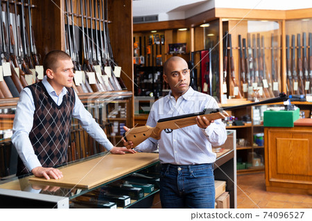 Guys are choosing pneumatic rifle in store Guys are choosing pneumatic rifle in store 74096527