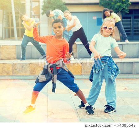 Kids training hip hop on city street Kids training hip hop on city street 74096542