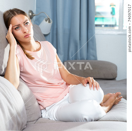 Woman suffering from headache Woman suffering from headache 74097017