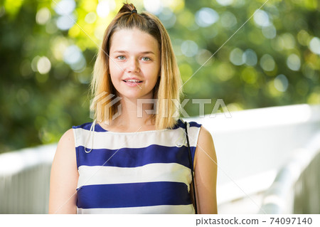 Closeup of girl on city park Closeup of girl on city park 74097140