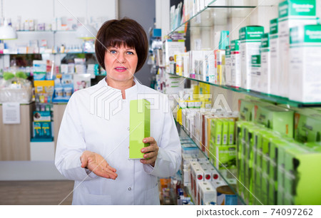 pharmacist working in shop pharmacist working in shop 74097262
