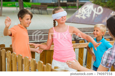 Girls and boys are playing in blindfolders 74097558