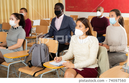 Adult students wearing masks for protect Covid-19 or corona virus disease , healthcare concept Adult students wearing masks for protect Covid-19 or corona virus disease , healthcare concept 74097560