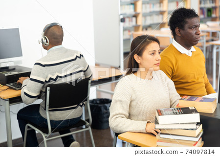 Young adult woman studying in computer class 74097814