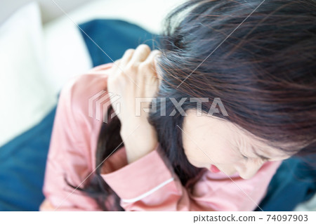 Woman with shoulder pain Woman with shoulder pain 74097903