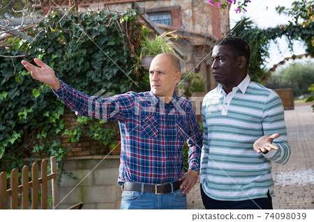 Conflict between neighbors in the country cottage Conflict between neighbors in the country cottage 74098039