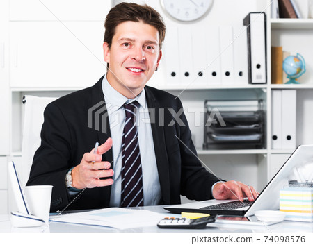 Man working in office Man working in office 74098576