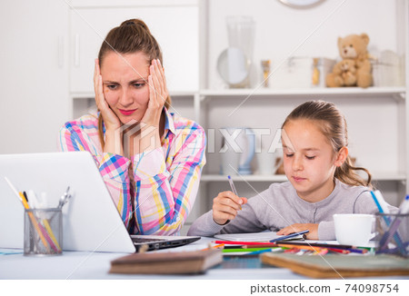 Irritated mother watching at the mistakes Irritated mother watching at the mistakes 74098754