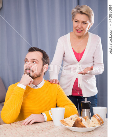 Mature mother and son quarrel 74099094