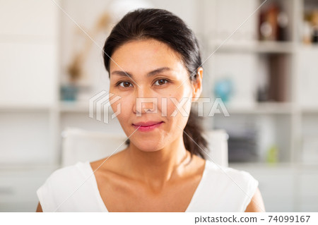 Portrait of young smiling kazhahstani woman in the modern office 74099167
