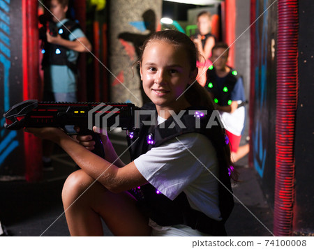 Girl playing laser tag 74100008