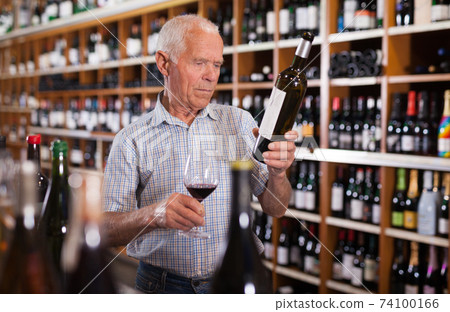 Senior male tasting wines in winery Senior male tasting wines in winery 74100166
