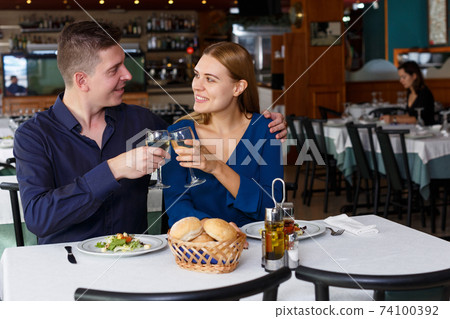 Romantic couple at restaurant Romantic couple at restaurant 74100392