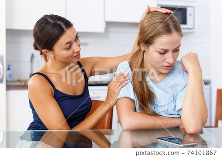 Woman trying to support her sad friend Woman trying to support her sad friend 74101867