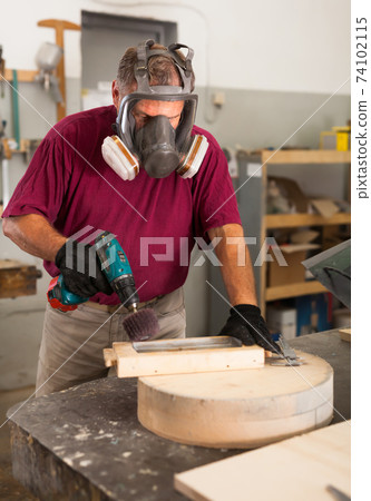 Worker in protective mask grinds wooden 3d detail Worker in protective mask grinds wooden 3d detail 74102115