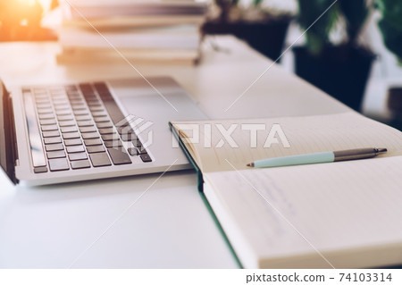 Working space on clean nature workspace at home with laptop, planner notebook and calculator. Business finance office. 74103314