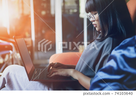 asian teenager studying online at home while outbreaking of covid-19 asian teenager studying online at home while outbreaking of covid-19 74103640