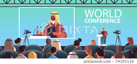 arab male doctor giving speech at tribune with microphone medical conference meeting medicine healthcare 74105116