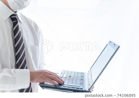 Senior businessman who can't work without a computer Senior businessman who can't work without a computer 74106895