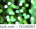 Abstract green bokeh texture on black background 74106965