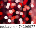 Abstract red bokeh texture on black background 74106977