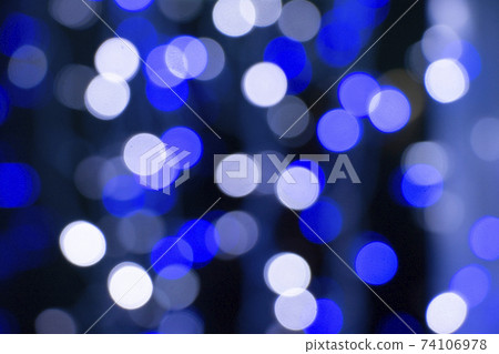 Abstract blue bokeh texture on black background 74106978