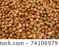 Forest nut background. Full and half of hazelnuts on white background top view. Isolated 74106979