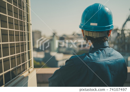 Building roof worker Building roof worker 74107497
