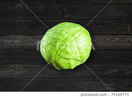 Green cabbage on concrete background 74109773