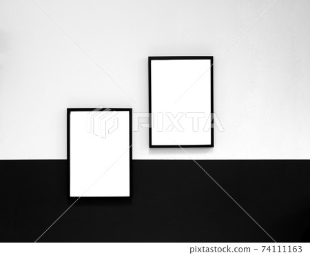Two blank Poster,canvas,frame hanging on black and white wall, interior design modern mock up frames copy space, Two blank Poster,canvas,frame hanging on black and white wall, interior design modern mock up frames copy space, 74111163
