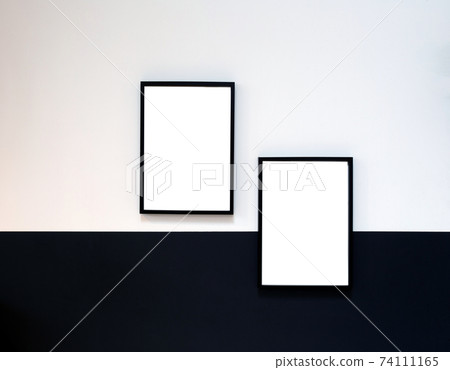 Two blank Poster,canvas,frame hanging on black and white wall, interior design modern mock up frames copy space, 74111165