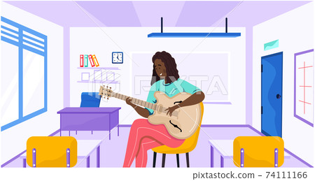 Woman sitting with guitar in hands. Musician plays strings on musical instrument at school 74111166